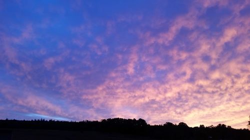 Low angle view of dramatic sky at sunset