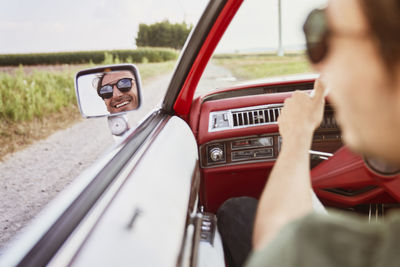 Man driving car on road