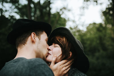 Couple kissing in park