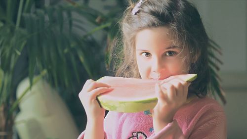 Close-up portrait of girl eating food