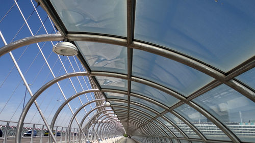 Metallic structure over walkway at bridge