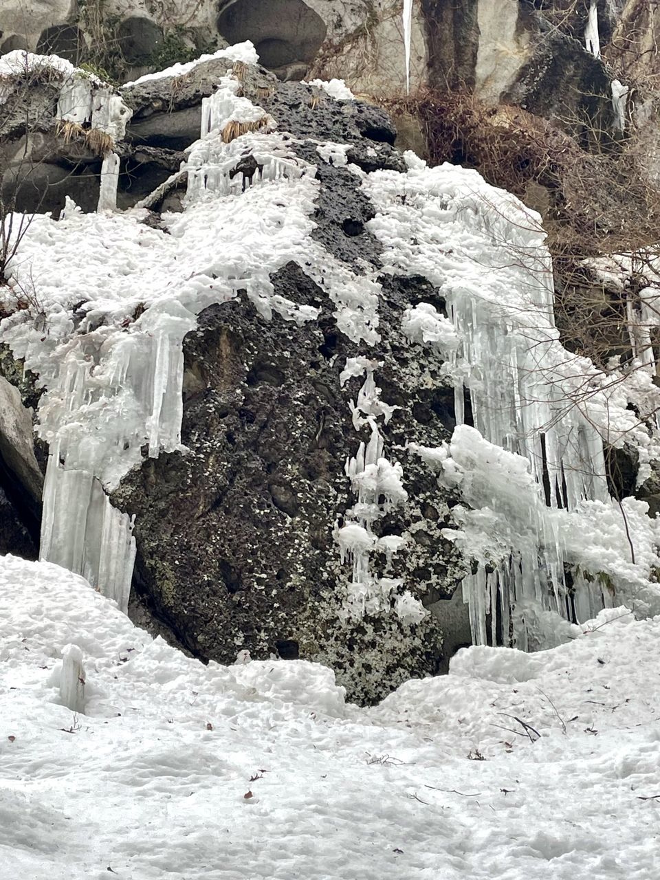 winter, snow, cold temperature, ice, nature, no people, frozen, day, rock, beauty in nature, white, outdoors, scenics - nature, environment, freezing, waterfall, tranquility, non-urban scene, land, rock formation, geology, mountain