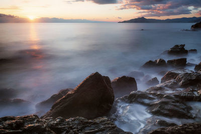 Scenic view of sea against sky during sunset