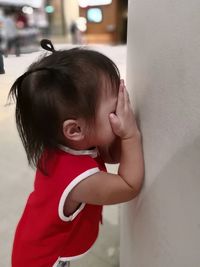 Cute boy looking at camera at home