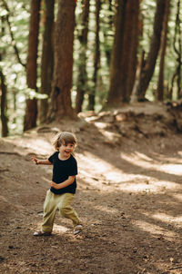 Full length of boy in forest