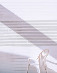 Stylish location in the city wallpaper. minimal, geometry and summer shadows. wall and chair