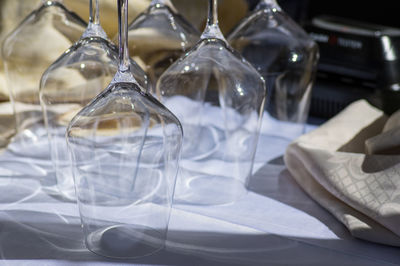 Close-up of empty glasses on table