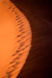 Scenic view of sand dunes against sky