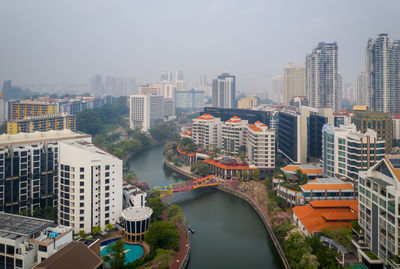 High angle view of buildings in city against sky