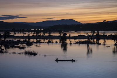 Scenic view of lake during sunset