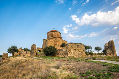 Old ruin building against blue sky