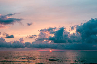 Scenic view of sea against sky at sunset