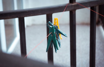 Clothespins hanging on clothesline