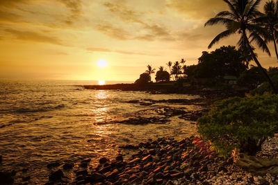 Scenic view of sea at sunset