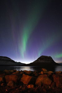 Scenic view of mountains against sky at night