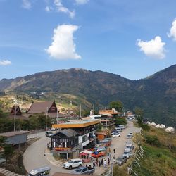 High angle view of buildings and mountains against sky