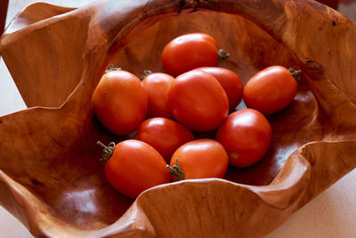 High angle view of tomatoes in basket on table
