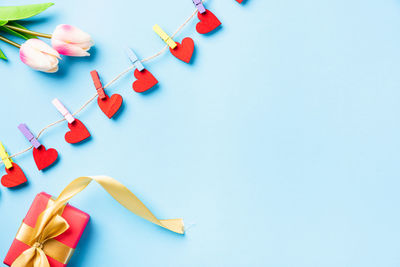 Directly above shot of christmas decorations against blue background