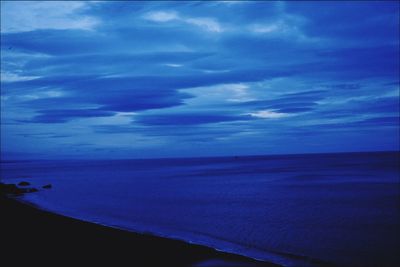 Scenic view of sea against blue sky