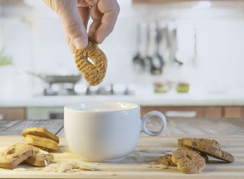Cropped hand of person preparing food