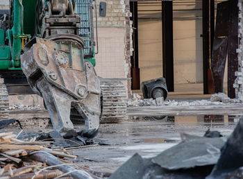 Excavator rips off a building