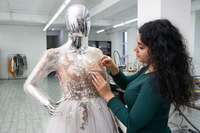 Fashion designer working at workshop