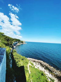 Scenic view of sea against blue sky