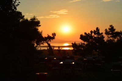 Silhouette trees against sky during sunset