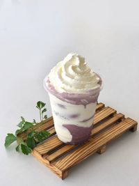 High angle view of dessert on table against white background