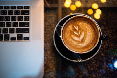 High angle view of coffee cup on table