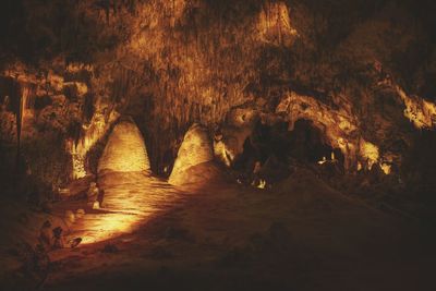 Illuminated cave at night