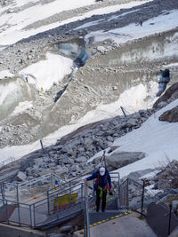 High angle view of people on snowcapped mountains during winter