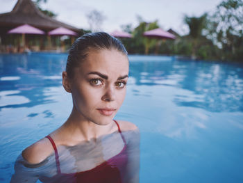 Portrait of young woman in swimming pool