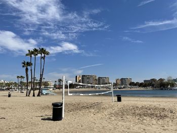 Scenic view of beach against sky in city