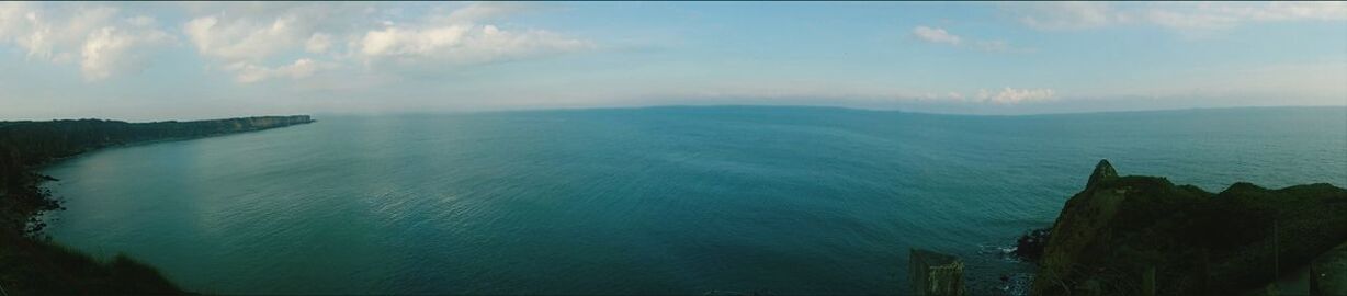 tranquil scene, scenics, tranquility, sky, beauty in nature, sea, water, nature, cloud - sky, horizon over water, idyllic, mountain, cloud, panoramic, non-urban scene, outdoors, remote, cloudy, cliff, high angle view