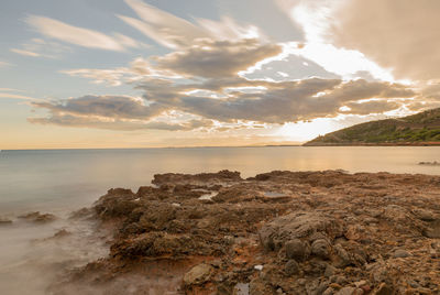 Scenic view of sea against sky at sunset