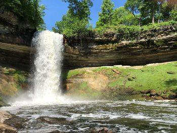 Scenic view of waterfall in forest