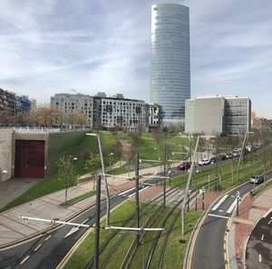 High angle view of street amidst buildings against sky