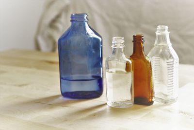 Close-up of glass bottle on table