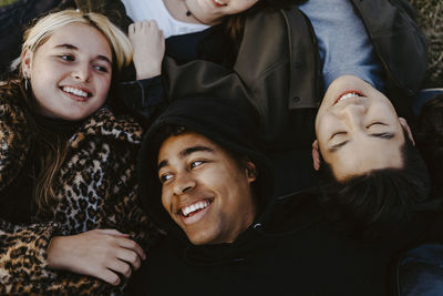 High angle view of friends lying down