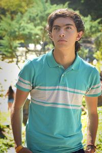 Teenage boy standing outdoors