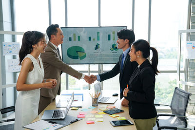 Business colleagues working at office