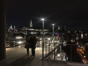 Man on illuminated city at night