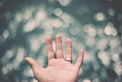 Cropped image of woman standing against wall
