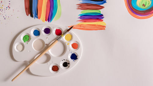 High angle view of various paint on table