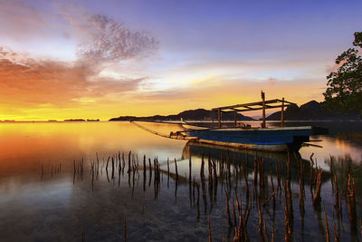 Scenic view of lake against sky during sunset