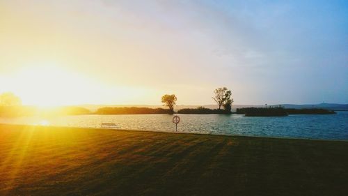 Scenic view of lake at sunset