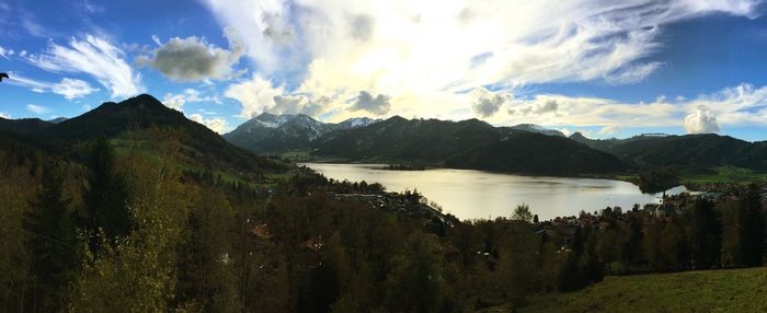 Scenic view of lake against cloudy sky