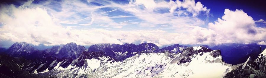 Scenic view of mountains against cloudy sky