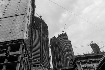 Low angle view of buildings against sky in city